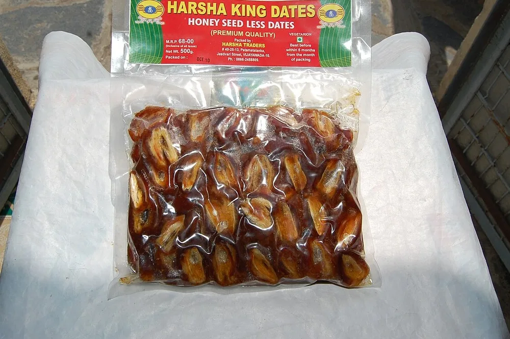 Several date varieties displayed side by side on a sales counter